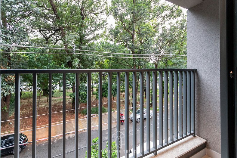 Balcony, tree-lined view near Av. Santo Amaro